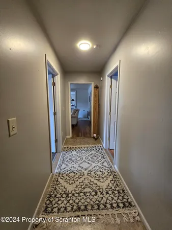 a bathroom with a sink a mirror and a shower