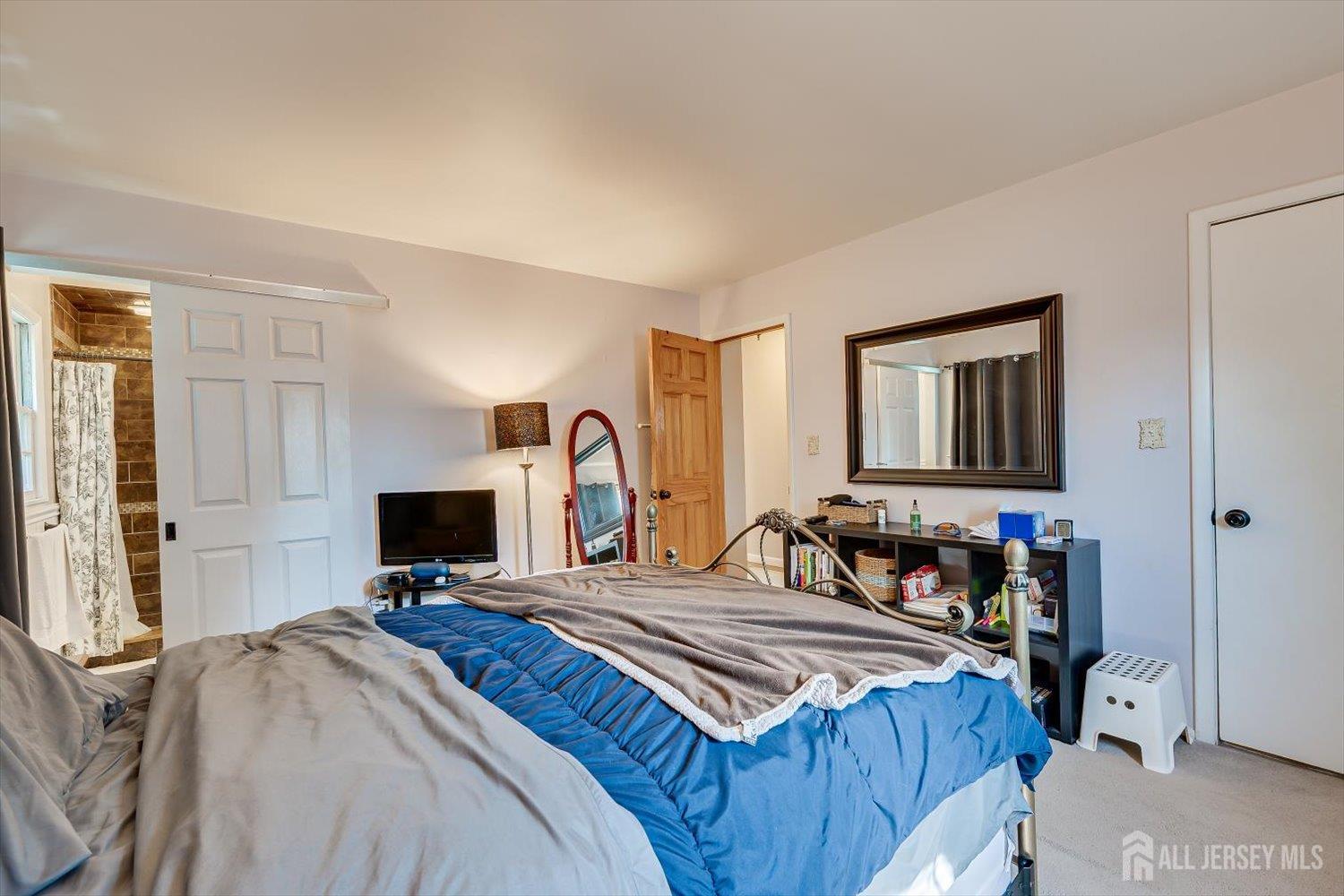 12 Gales Road Edison, NJ 08837 - Photo 18 of 35 a bedroom with a bed and a flat screen tv