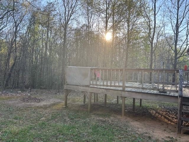 291 Highland Estates Commerce, GA 30529 - Photo 14 of 15 a backyard of a house with table and chairs