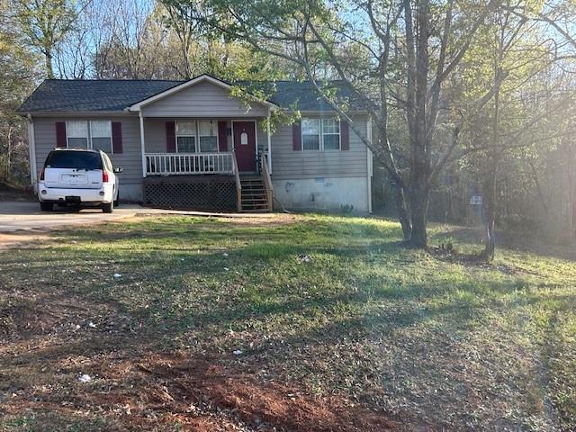 291 Highland Estates Commerce, GA 30529 - Photo 2 of 15 a front view of a house with a yard