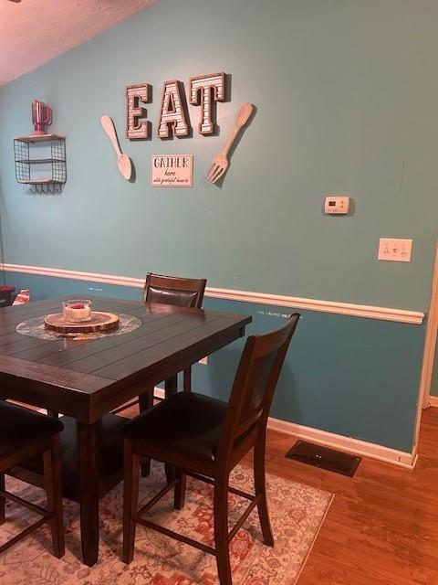 291 Highland Estates Commerce, GA 30529 - Photo 9 of 15 a view of a dining room with furniture and wooden floor