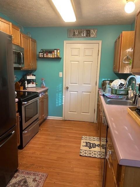 291 Highland Estates Commerce, GA 30529 - Photo 10 of 15 a kitchen with stainless steel appliances granite countertop a sink stove and refrigerator