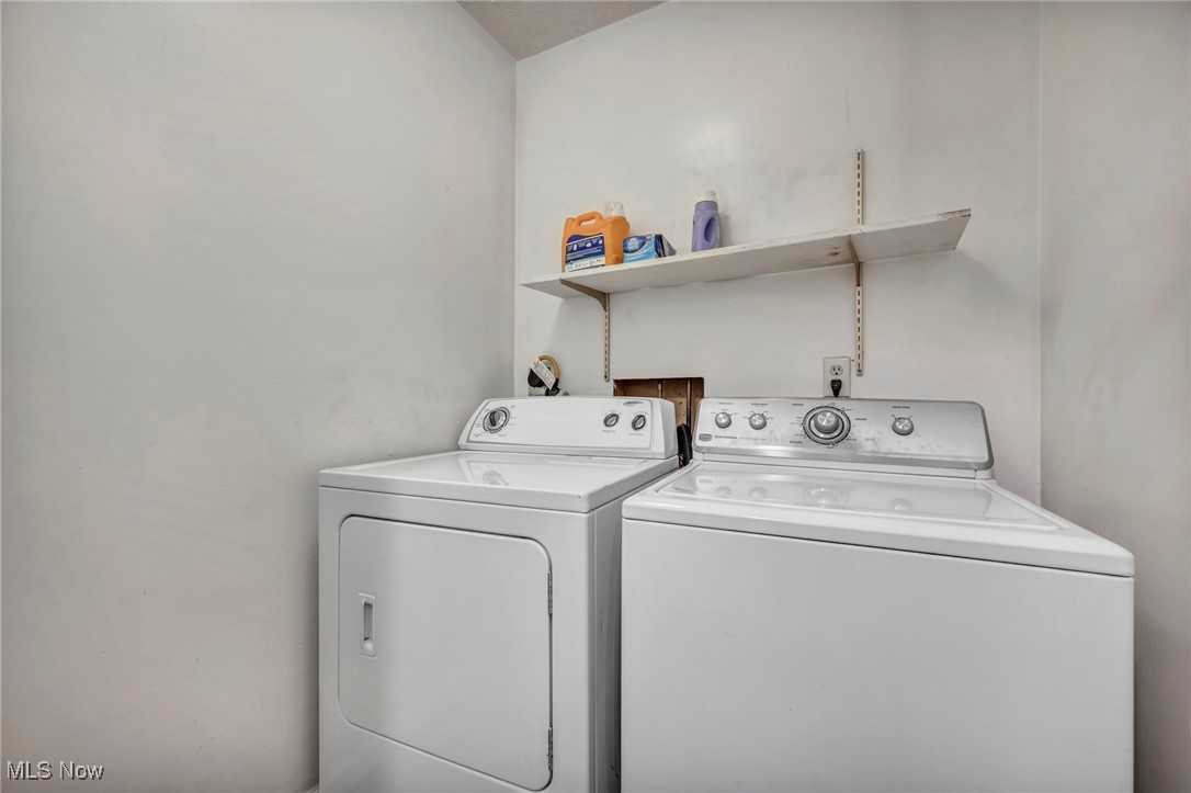 9956 Johnnycake Ridge Road, Unit B5 Painesville, OH 44077 - Photo 22 of 24 Laundry area with washing machine and dryer