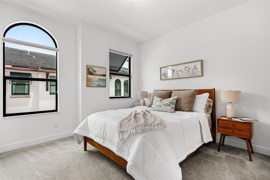 608 Windward Circle Boynton Beach, FL 33435 - Photo 14 of 26 a bedroom with a bed and a painting on the wall