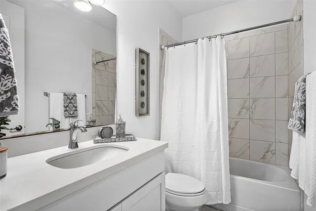 a bedroom with bed and window