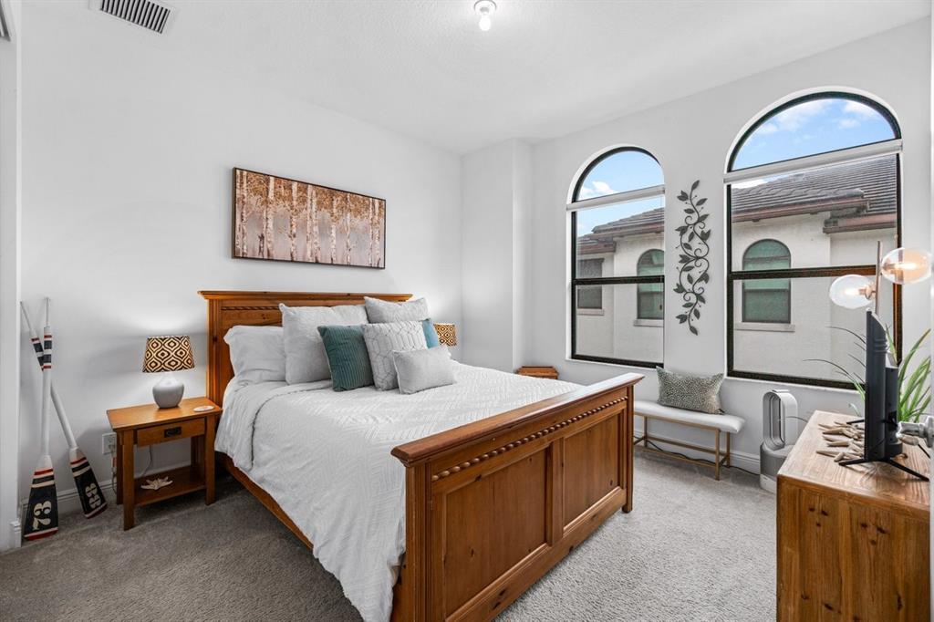 608 Windward Circle Boynton Beach, FL 33435 - Photo 16 of 26 a bedroom with bed and window