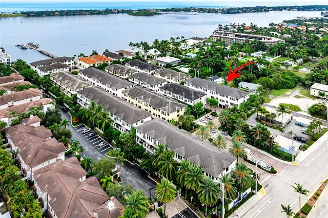 a front view of a building with a garden