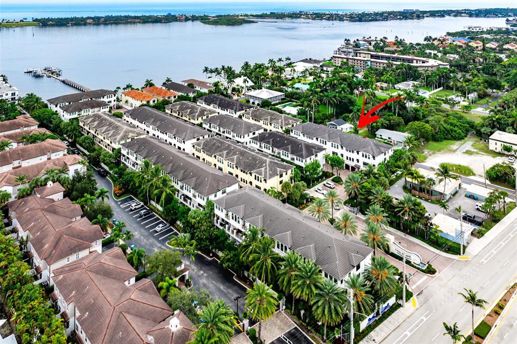 608 Windward Circle Boynton Beach, FL 33435 - Photo 18 of 26 a view of a lake with a flower garden