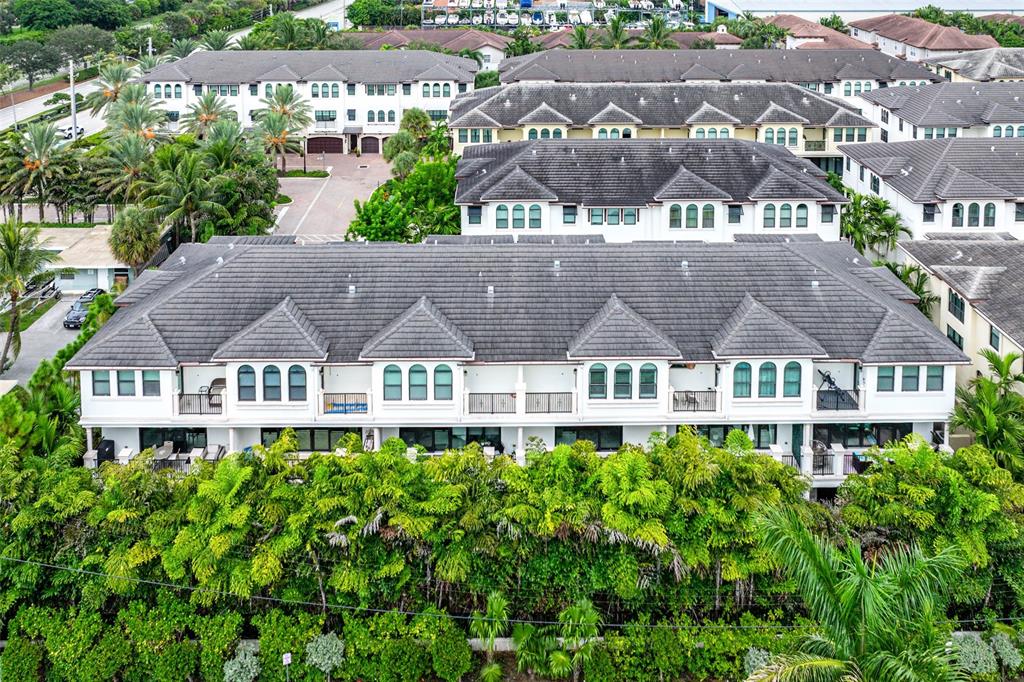 608 Windward Circle Boynton Beach, FL 33435 - Photo 19 of 26 a front view of a building with a garden