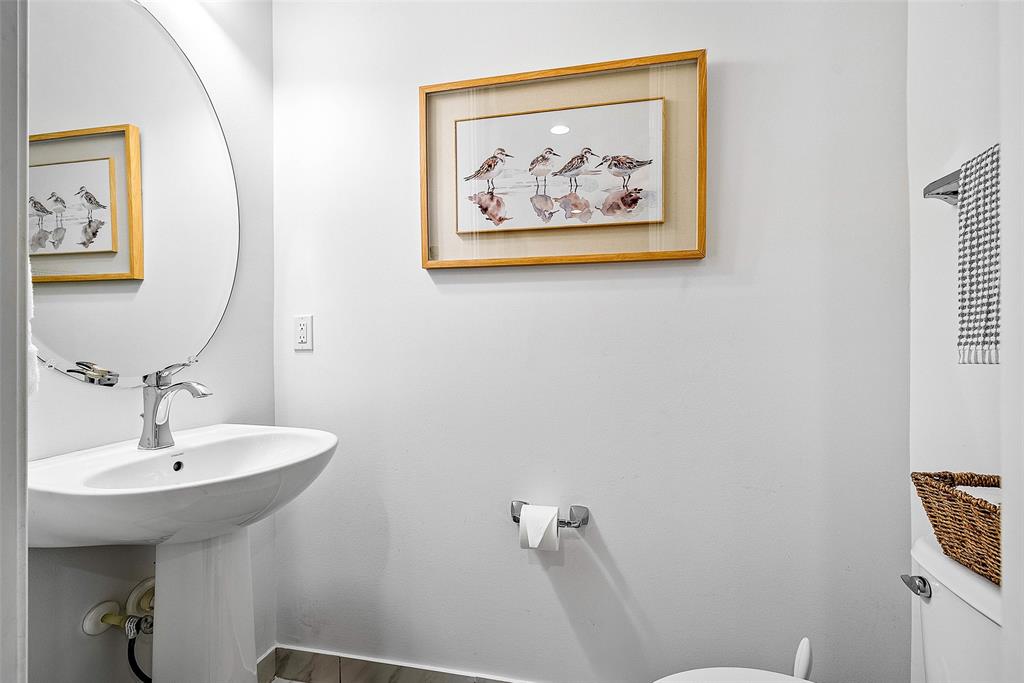 608 Windward Circle Boynton Beach, FL 33435 - Photo 22 of 26 a bathroom with a sink and mirror with toilet