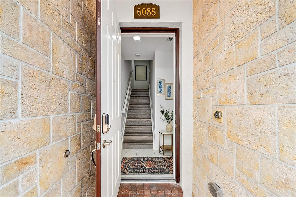 608 Windward Circle Boynton Beach, FL 33435 - Photo 23 of 26 a view of a hallway with wooden floor and entryway