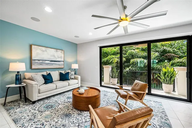 a living room with furniture and a large window