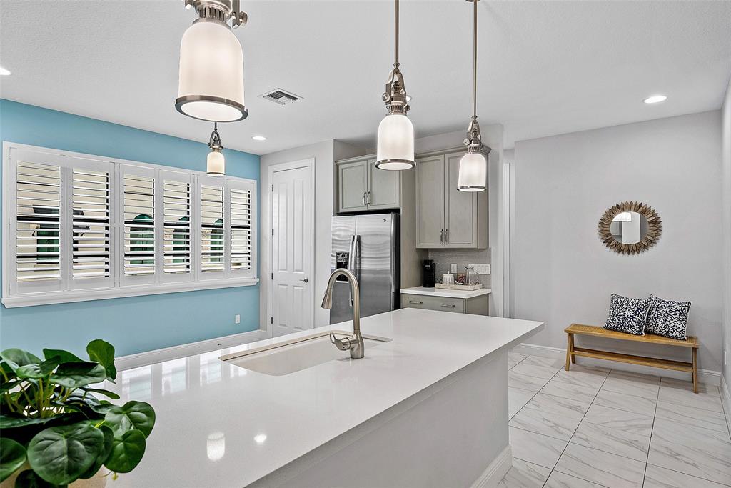 608 Windward Circle Boynton Beach, FL 33435 - Photo 9 of 26 a spacious bathroom with a granite countertop sink a mirror and a shower