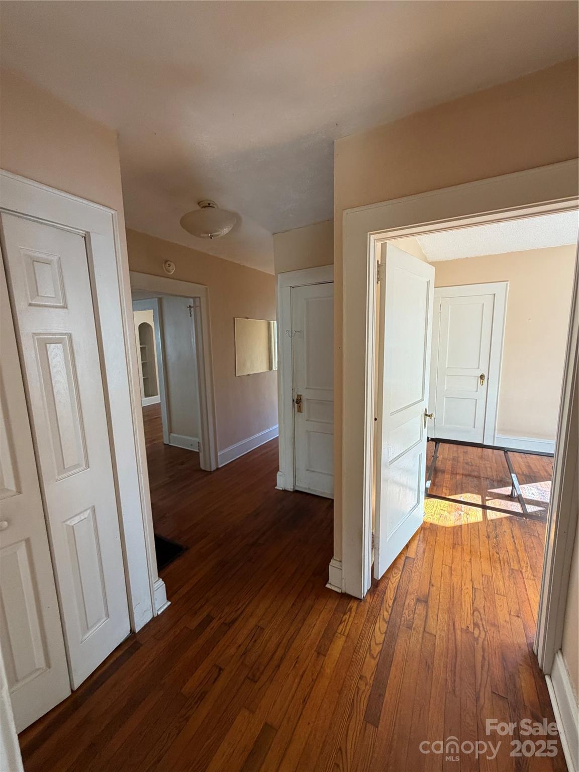 202 Snow Hill Road Bakersville, NC 28705 - Photo 11 of 27 a view of a hallway with wooden floor and staircase