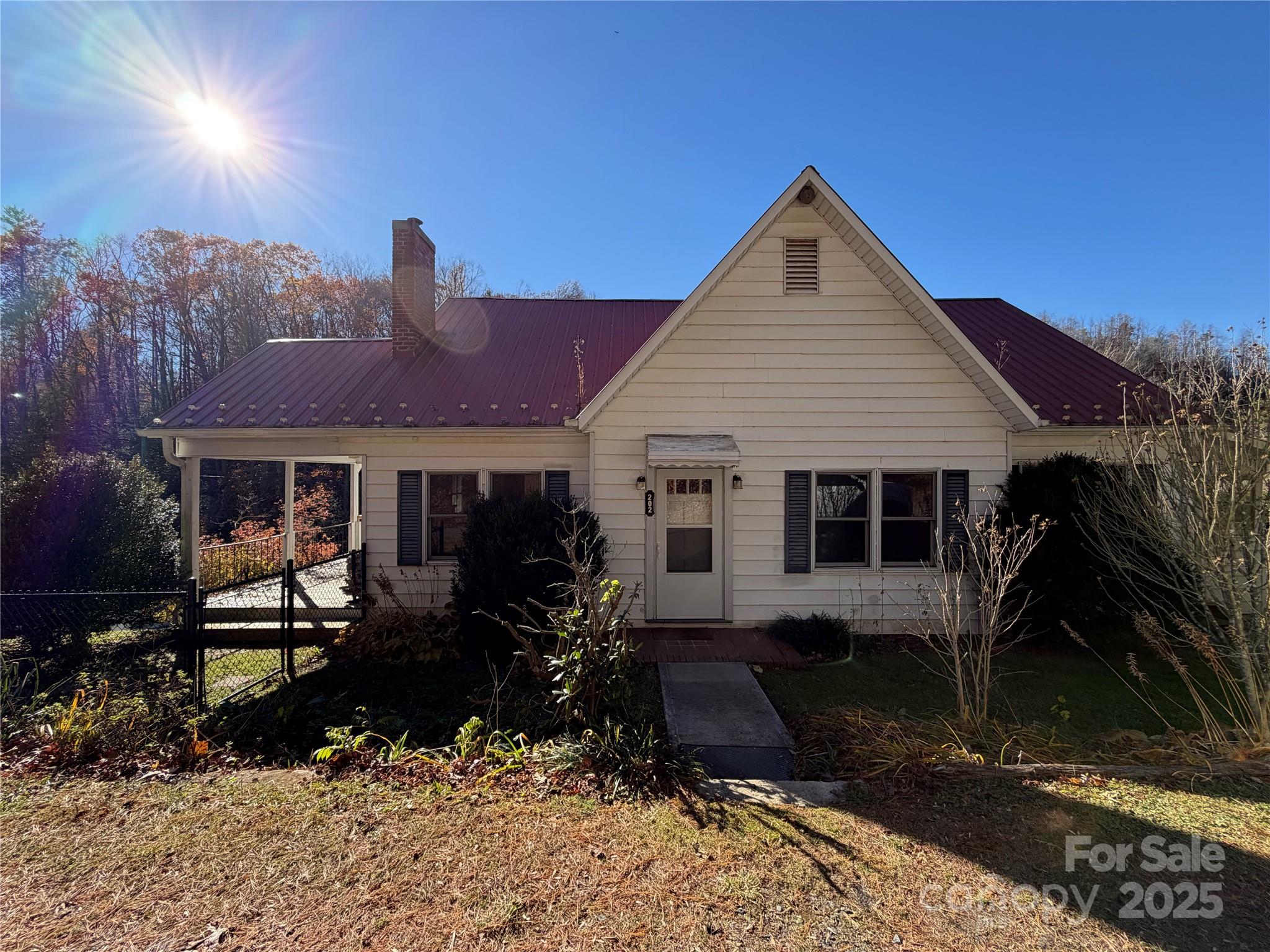 202 Snow Hill Road Bakersville, NC 28705 - Photo 21 of 27 a front view of a house with a yard