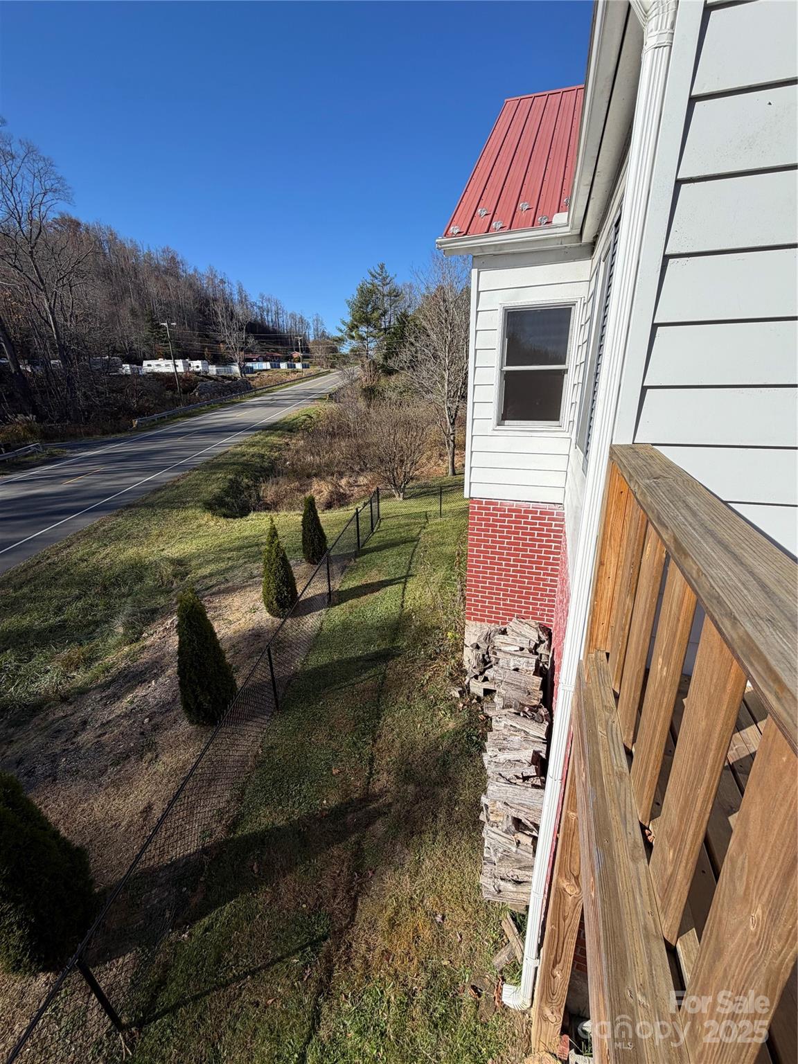 202 Snow Hill Road Bakersville, NC 28705 - Photo 22 of 27 a view of roof deck with couches and wooden floor