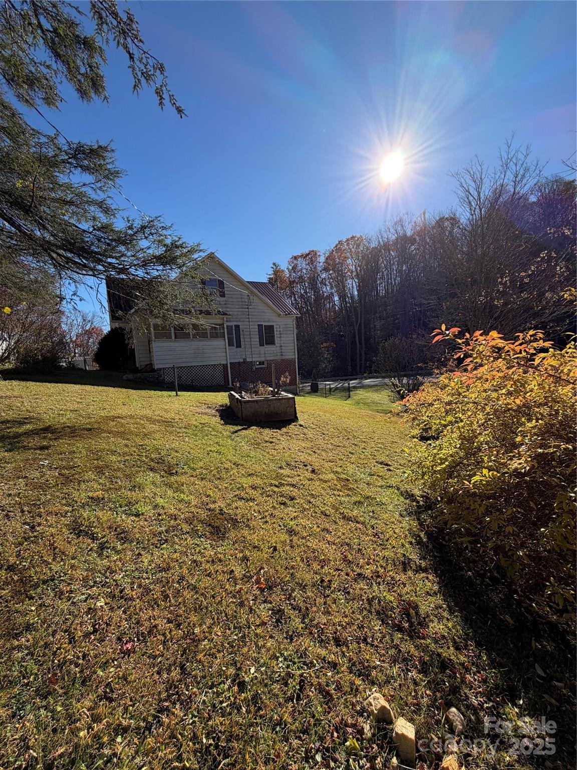 202 Snow Hill Road Bakersville, NC 28705 - Photo 25 of 27 a view of a house with a yard