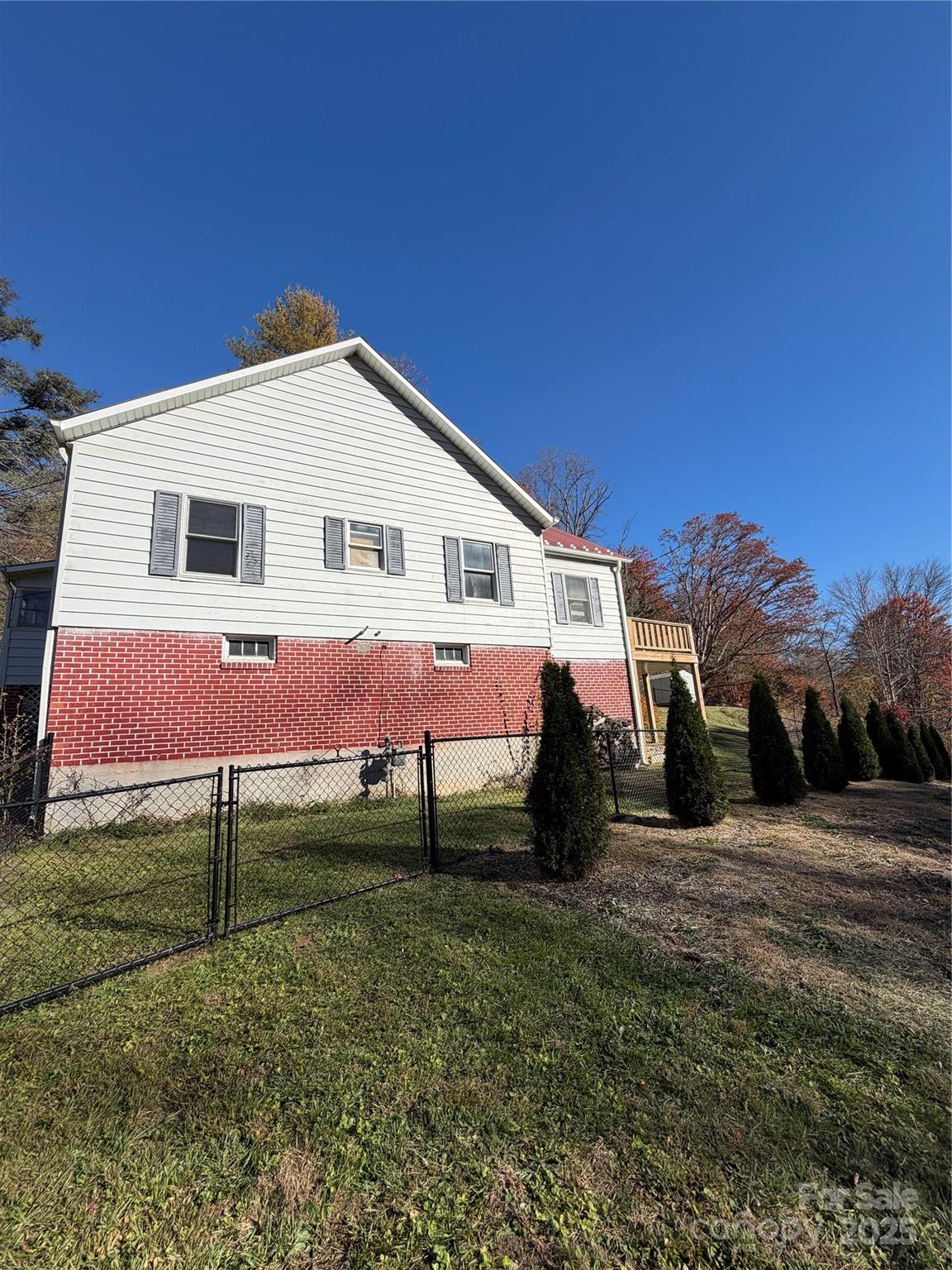 202 Snow Hill Road Bakersville, NC 28705 - Photo 27 of 27 a front view of a house with a yard