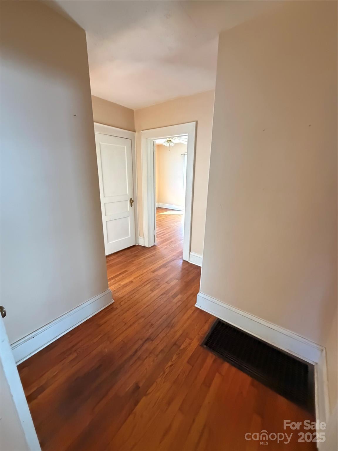 202 Snow Hill Road Bakersville, NC 28705 - Photo 6 of 27 wooden floor in an empty room with a window