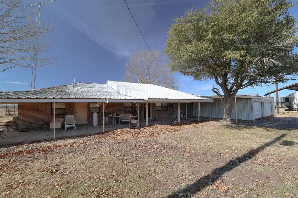 6482 County Road 4700 Commerce, TX 75428 - Photo 17 of 23 a view of a house with a patio
