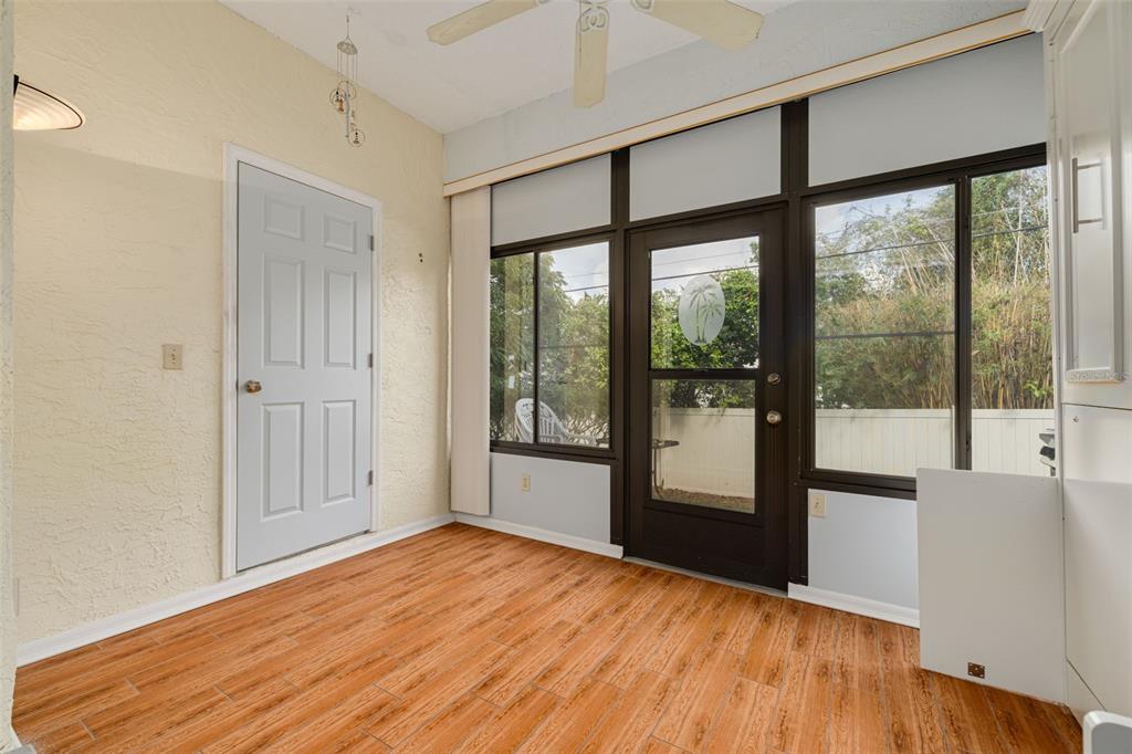 3590 Magnolia Ridge Circle, Unit C1103 Palm Harbor, FL 34684 - Photo 20 of 31 a view of empty room with wooden floor and fan