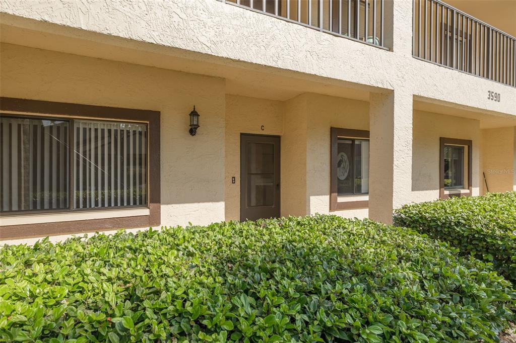 3590 Magnolia Ridge Circle, Unit C1103 Palm Harbor, FL 34684 - Photo 2 of 31 a front view of a house with a garage