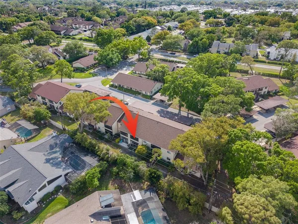 an aerial view of residential houses with outdoor space