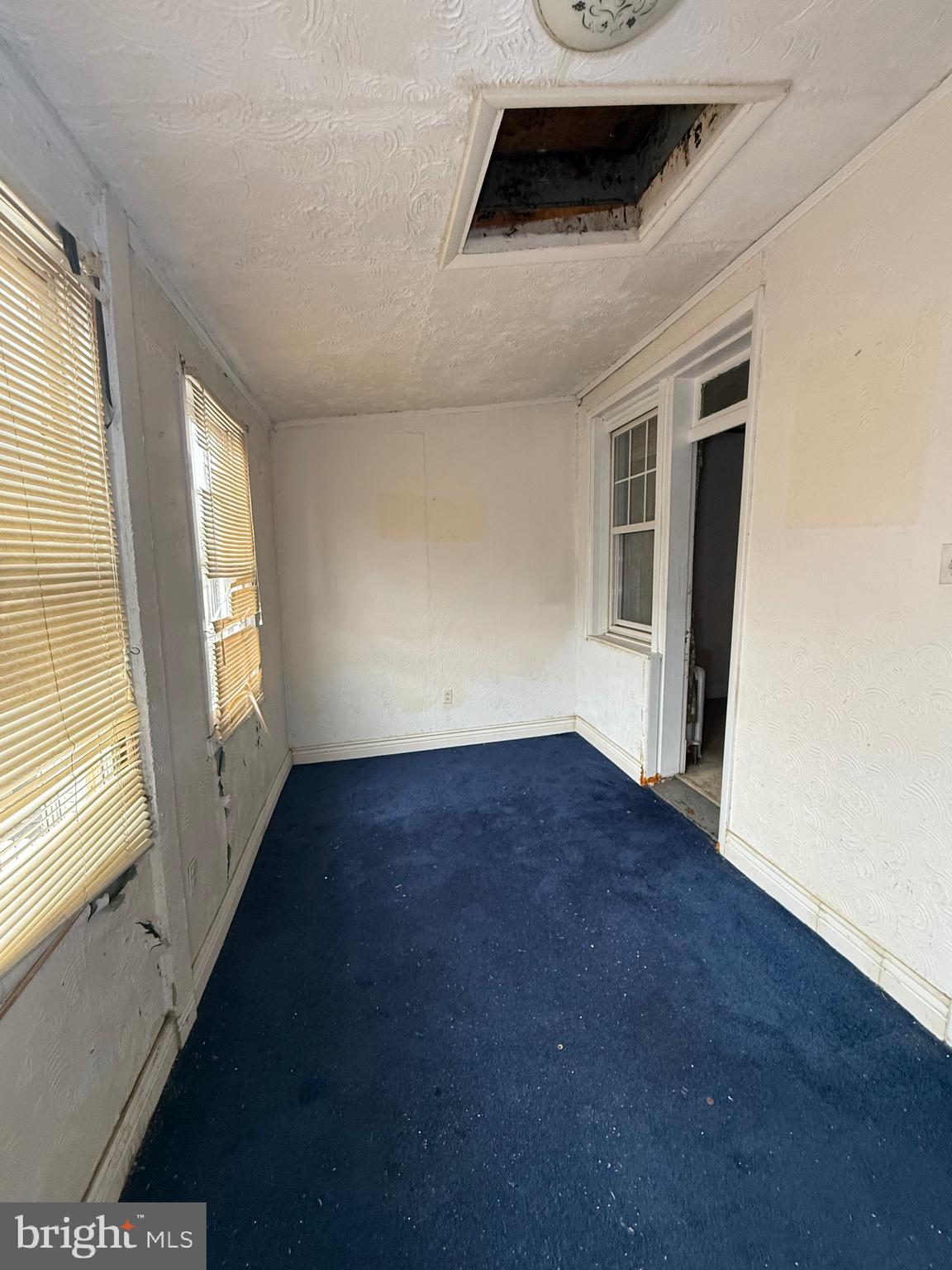 1418 E Street Northeast Washington, DC 20002 - Photo 15 of 17 a view of an empty room with wooden floor and a window