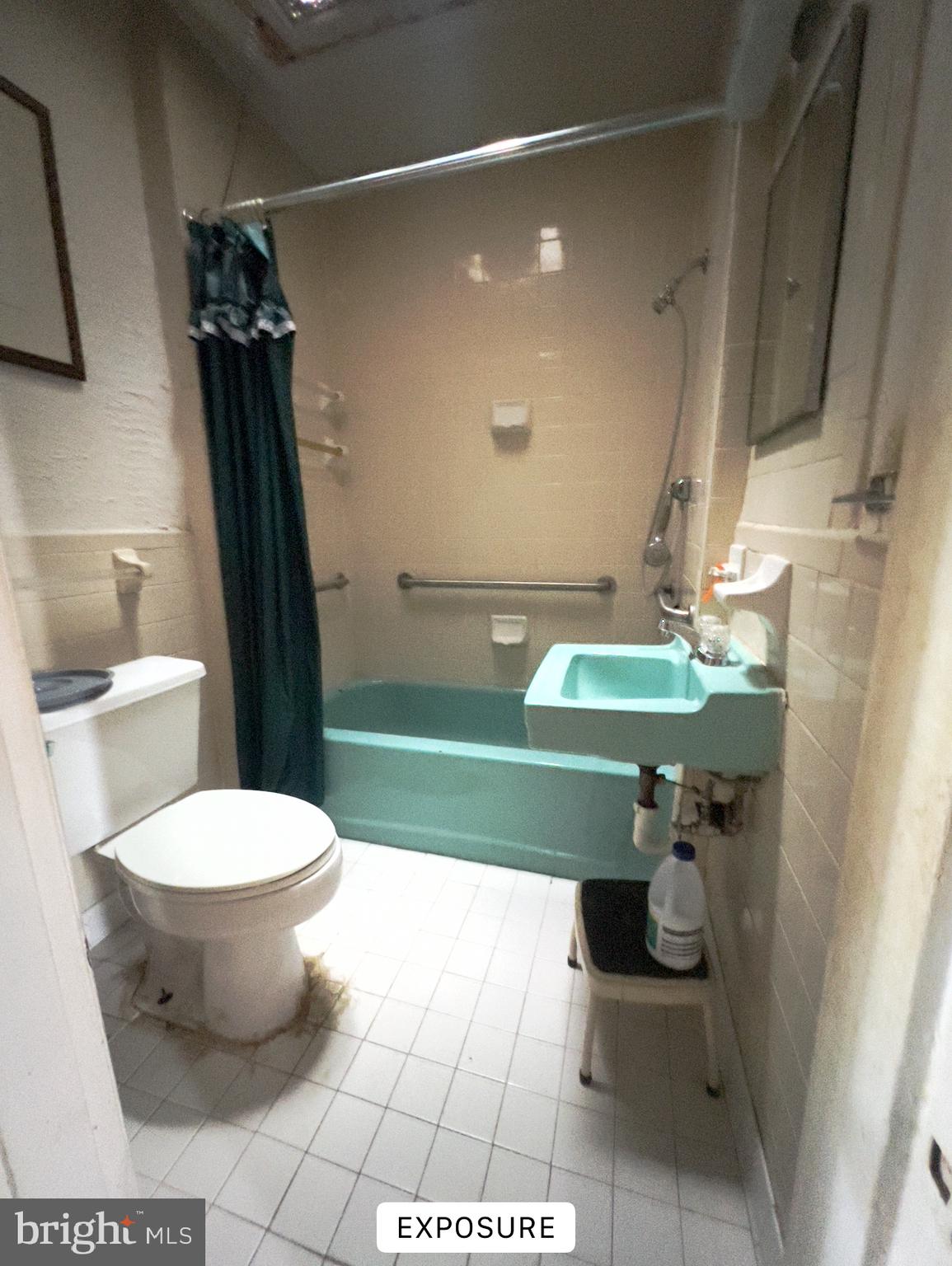 1418 E Street Northeast Washington, DC 20002 - Photo 16 of 17 a bathroom with a sink a toilet and a shower