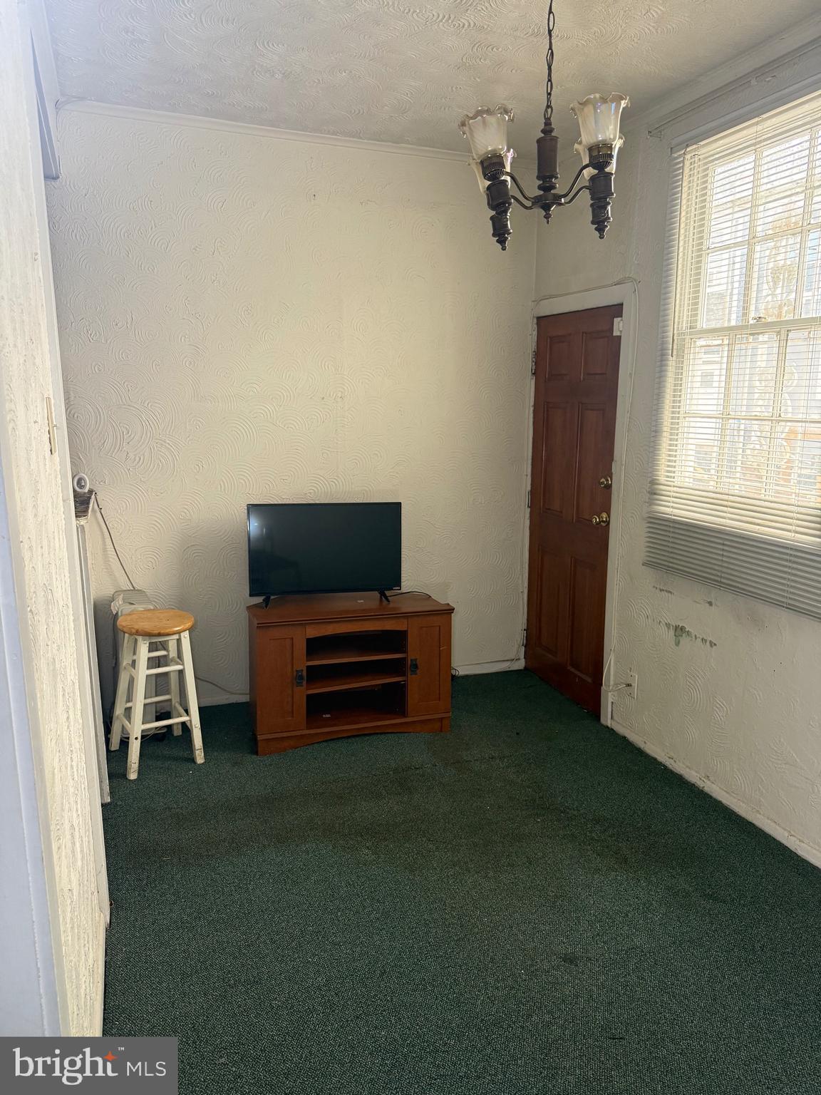 1418 E Street Northeast Washington, DC 20002 - Photo 7 of 17 a view of a livingroom with furniture and a window