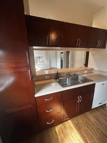 a kitchen with a sink and cabinets