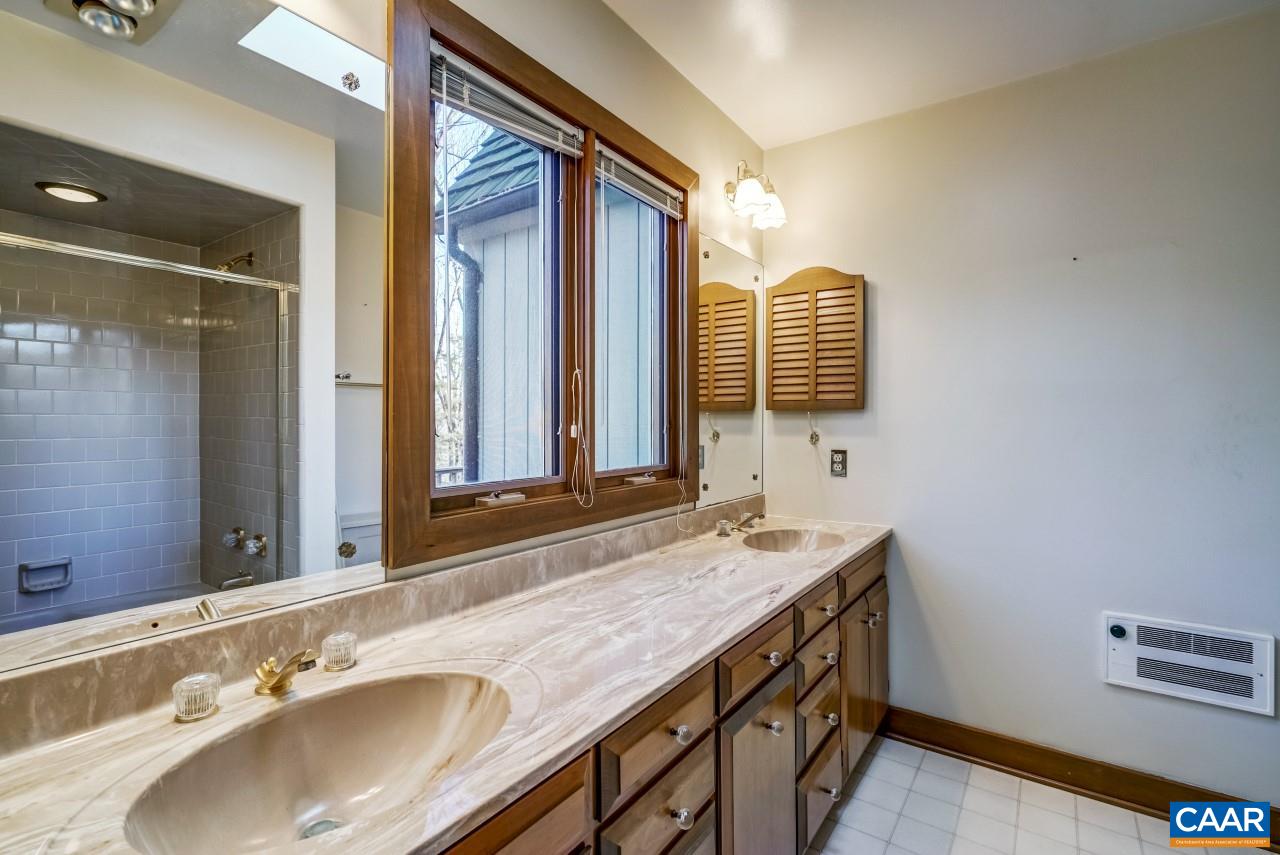 2525 Ranson Court Charlottesville, VA 22911 - Photo 18 of 31 a bathroom with a sink and a mirror