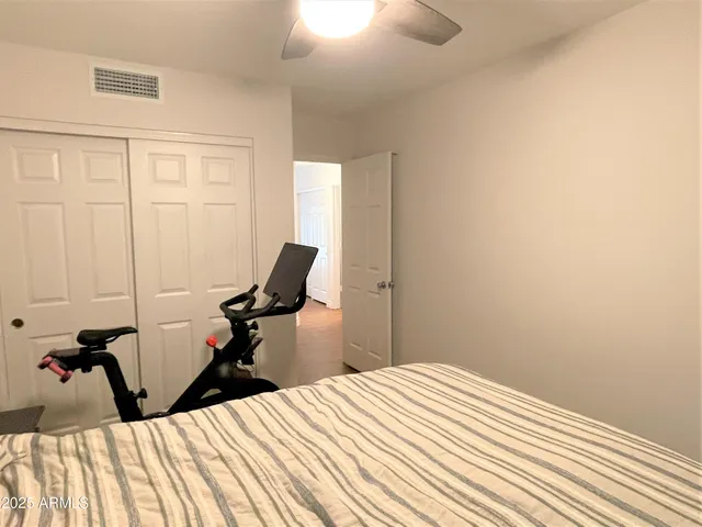 a bed room with a bed and a dresser