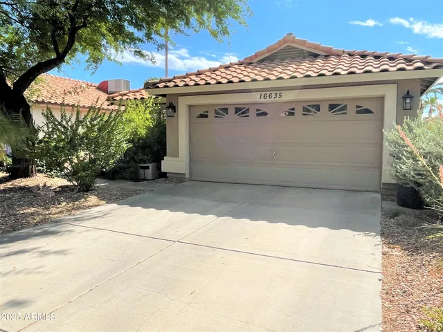 a view of a house with a garage