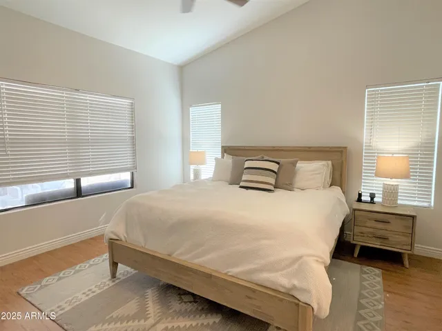 a bedroom with a bed and window