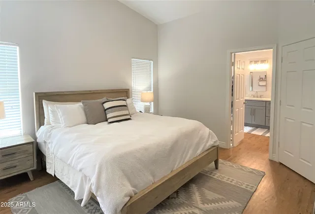 a bedroom with a bed and window