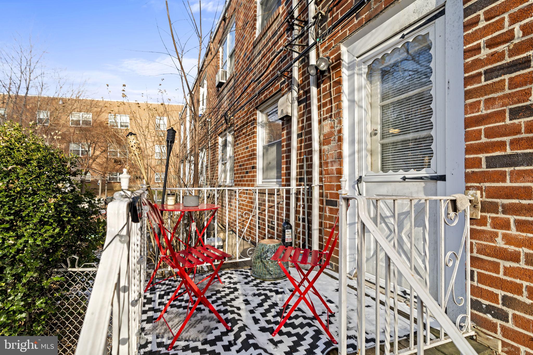 6014 Oakland Street Philadelphia, PA 19149 - Photo 12 of 13 a view of a brick wall with a tree in front of it