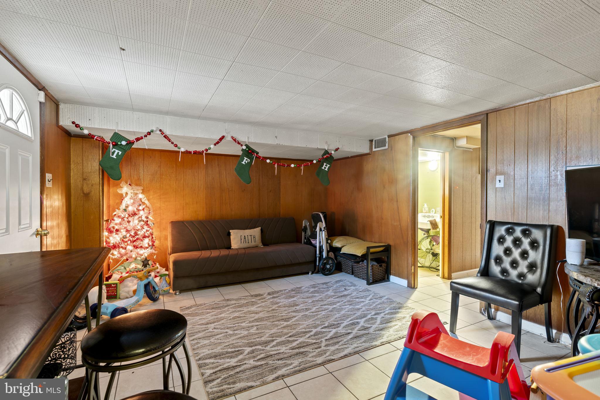 6014 Oakland Street Philadelphia, PA 19149 - Photo 8 of 13 a bedroom with furniture and a wooden floor