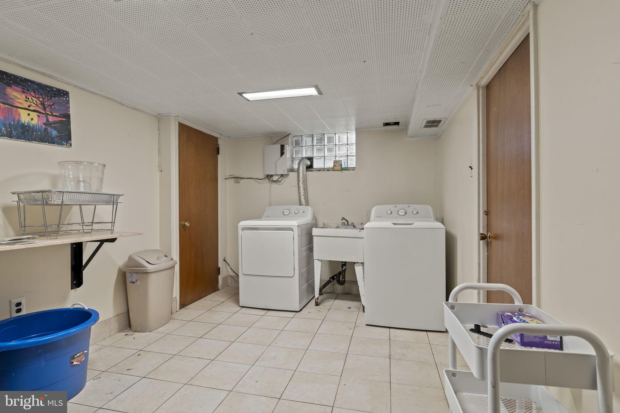 6014 Oakland Street Philadelphia, PA 19149 - Photo 10 of 13 a bathroom with a toilet and a sink