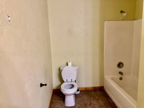 a bathroom with a toilet and a sink