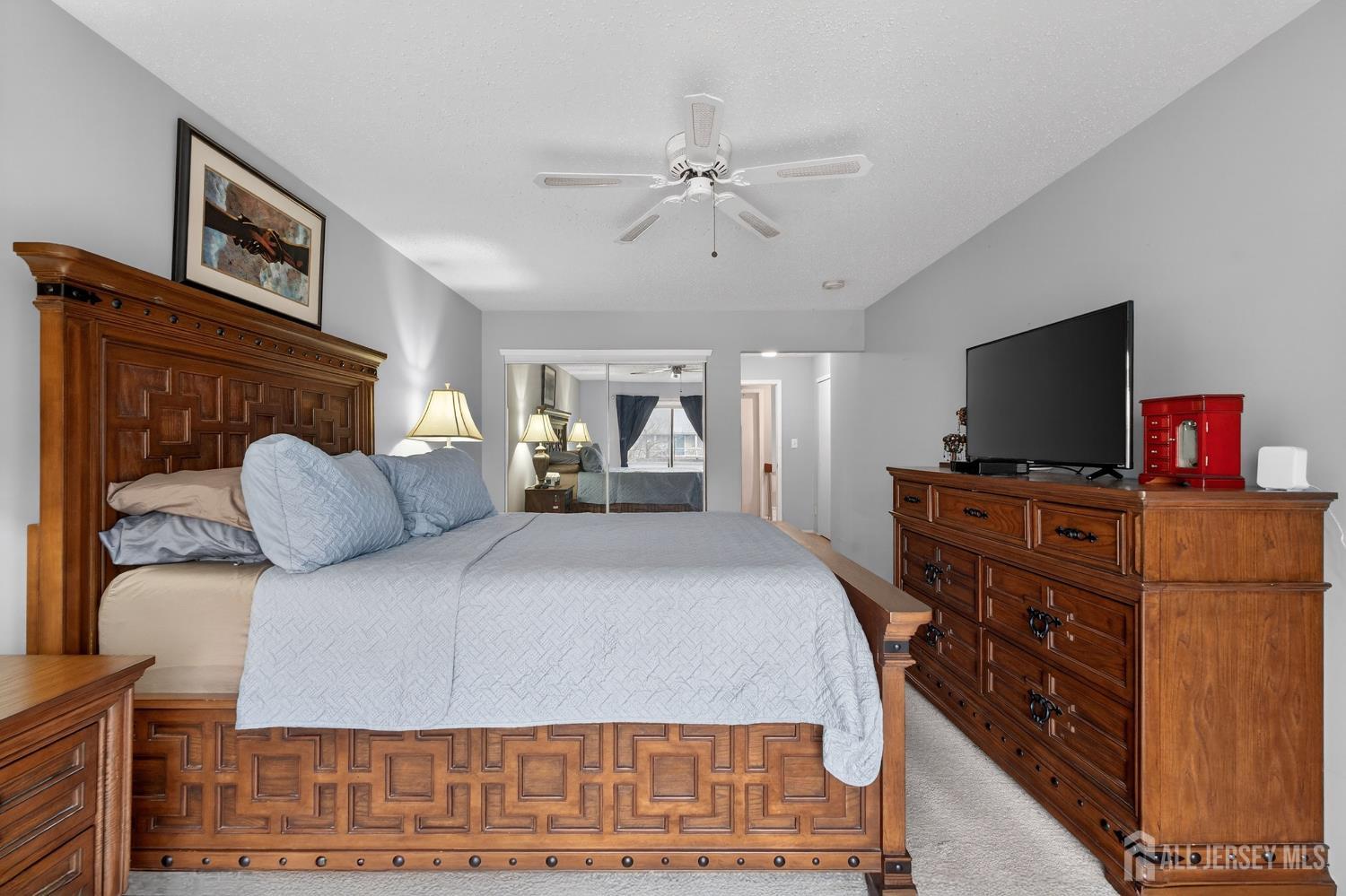 99 Kelly Drive Edison, NJ 08820 - Photo 13 of 29 a bedroom with a bed and a flat screen tv