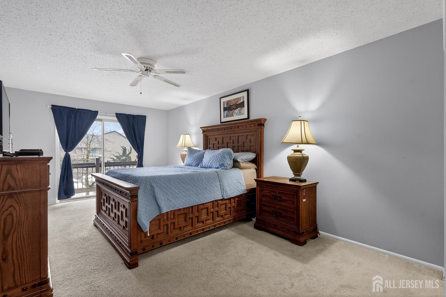 99 Kelly Drive Edison, NJ 08820 - Photo 14 of 29 a bed room with a bed and a lamp