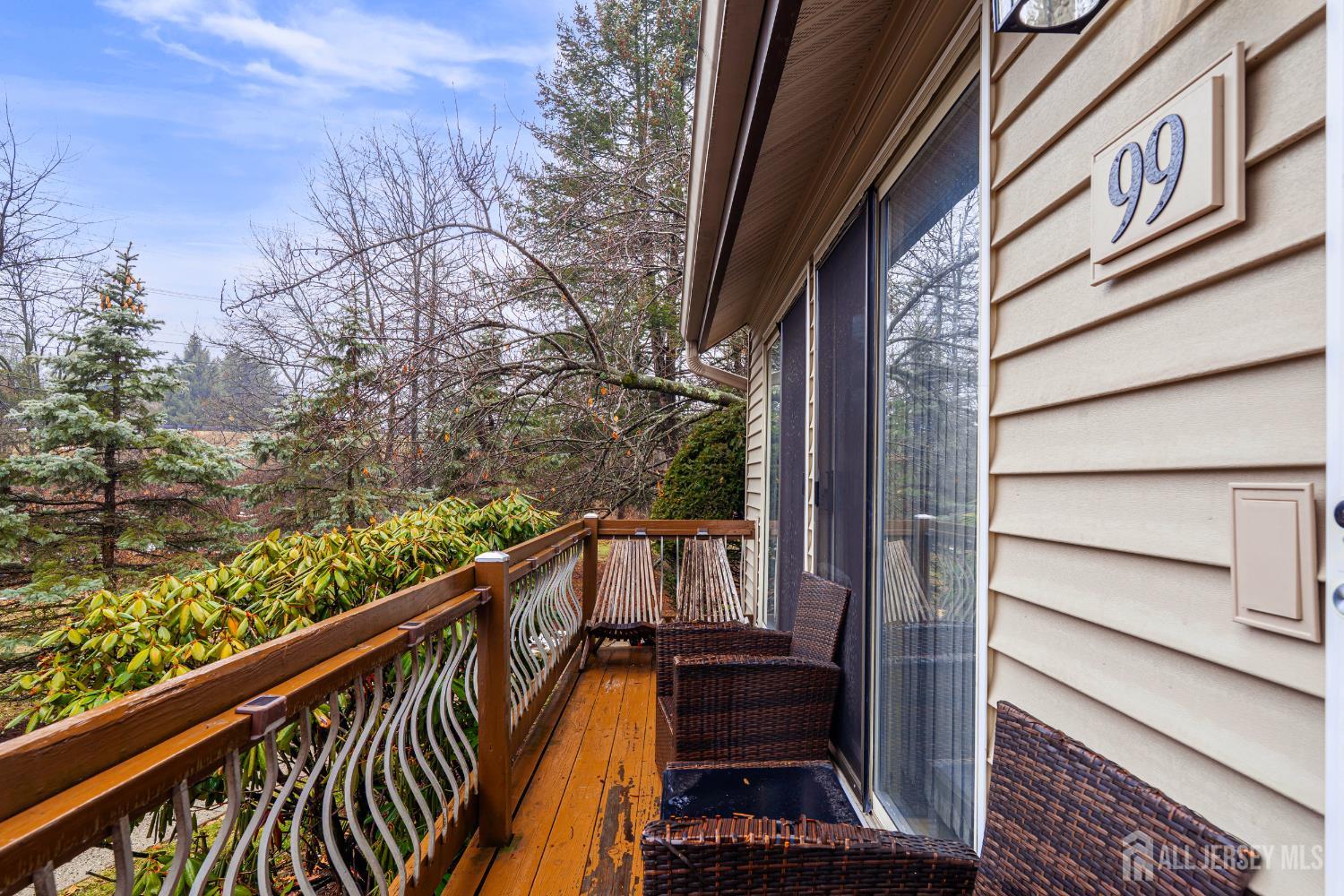 99 Kelly Drive Edison, NJ 08820 - Photo 2 of 29 a view of balcony with wooden floor and fence