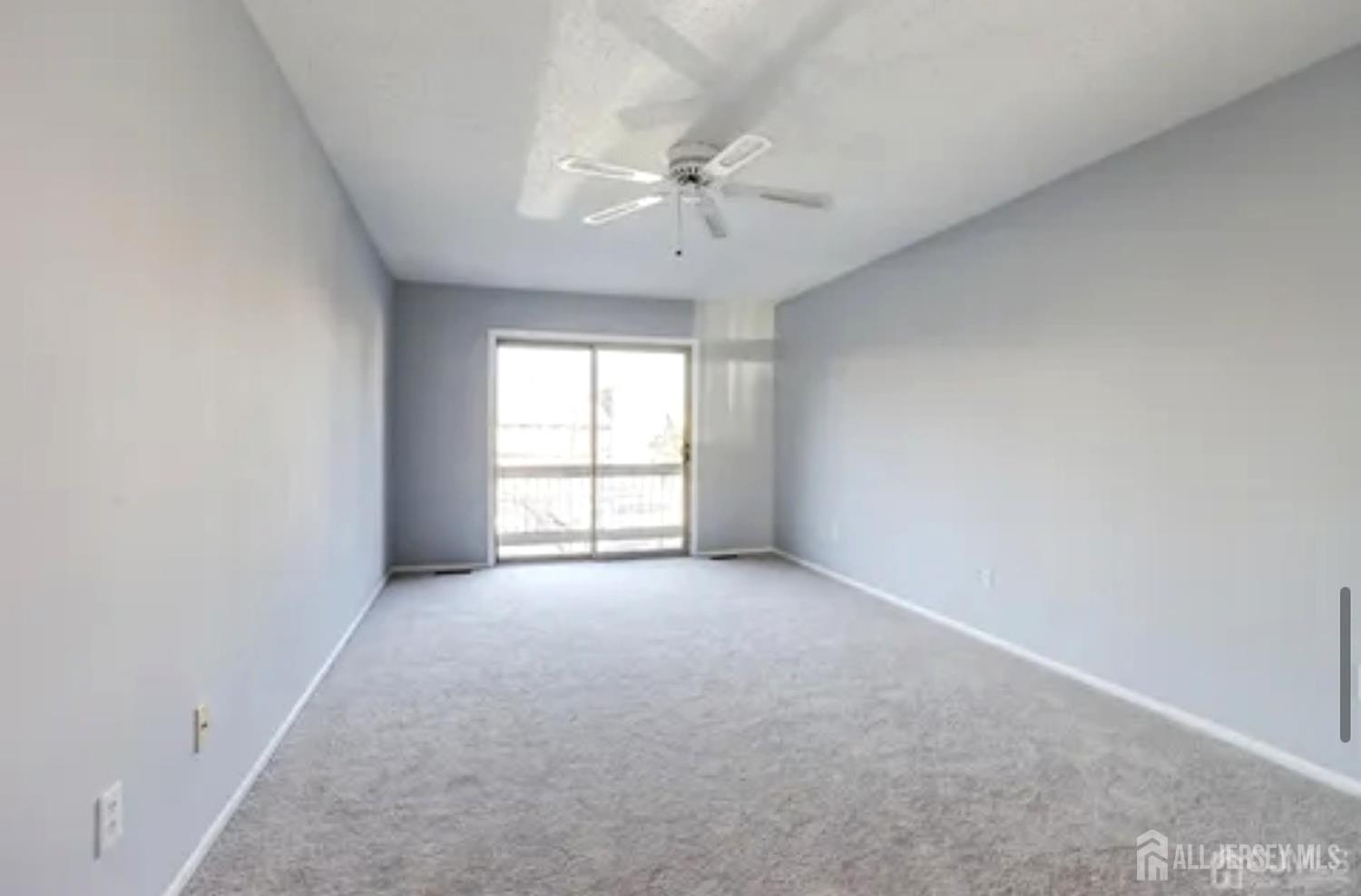 99 Kelly Drive Edison, NJ 08820 - Photo 25 of 29 an empty room with a window and a ceiling fan