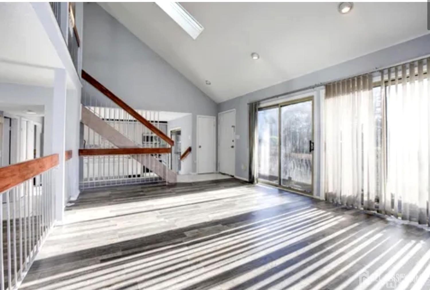 99 Kelly Drive Edison, NJ 08820 - Photo 28 of 29 a view of a hallway with wooden floor and windows