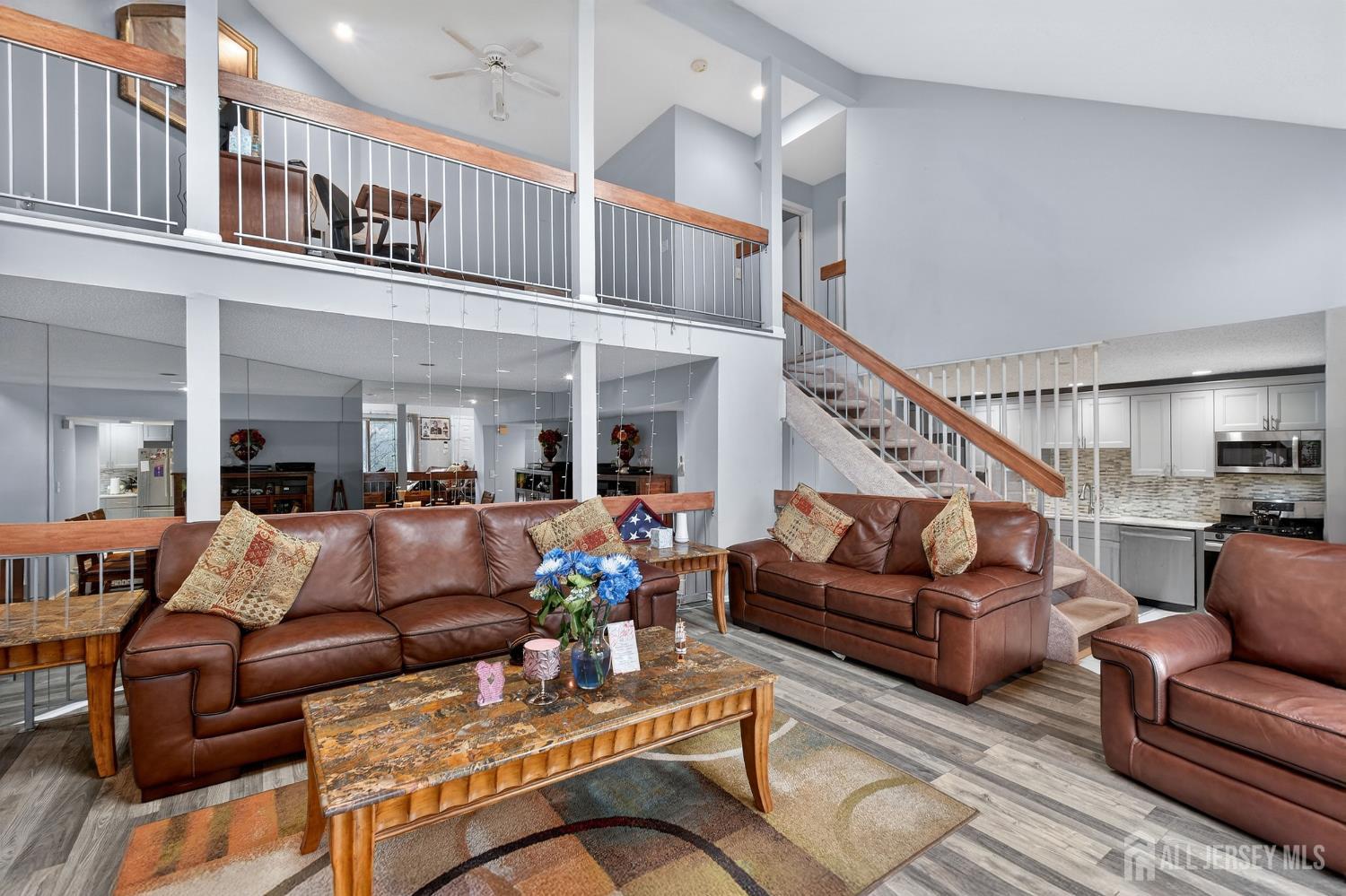99 Kelly Drive Edison, NJ 08820 - Photo 3 of 29 a living room with furniture or stairs and a couch