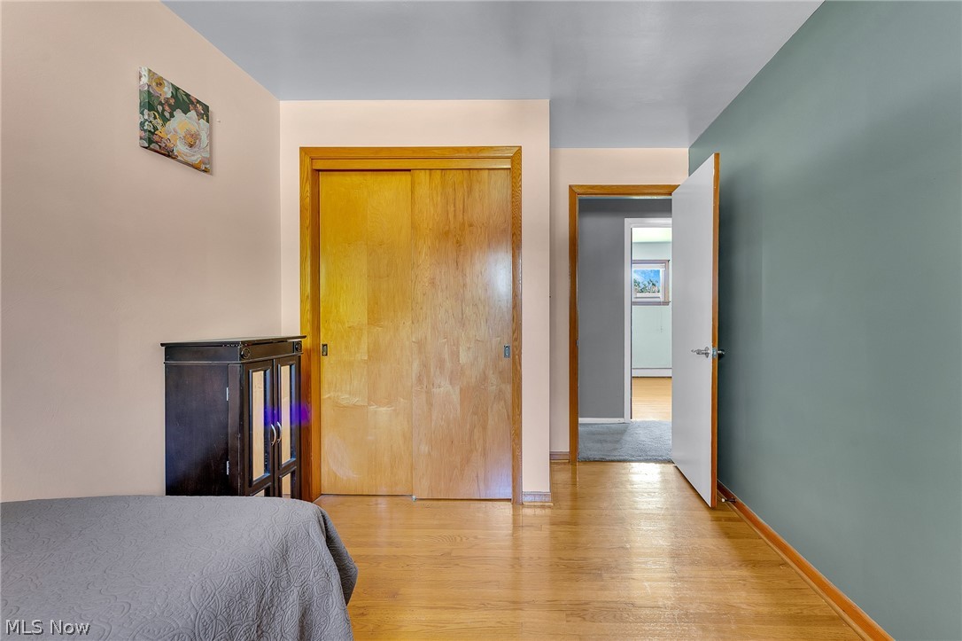 4685 New Road Youngstown, OH 44515 - Photo 26 of 37 Bedroom with light hardwood / wood-style flooring and a closet