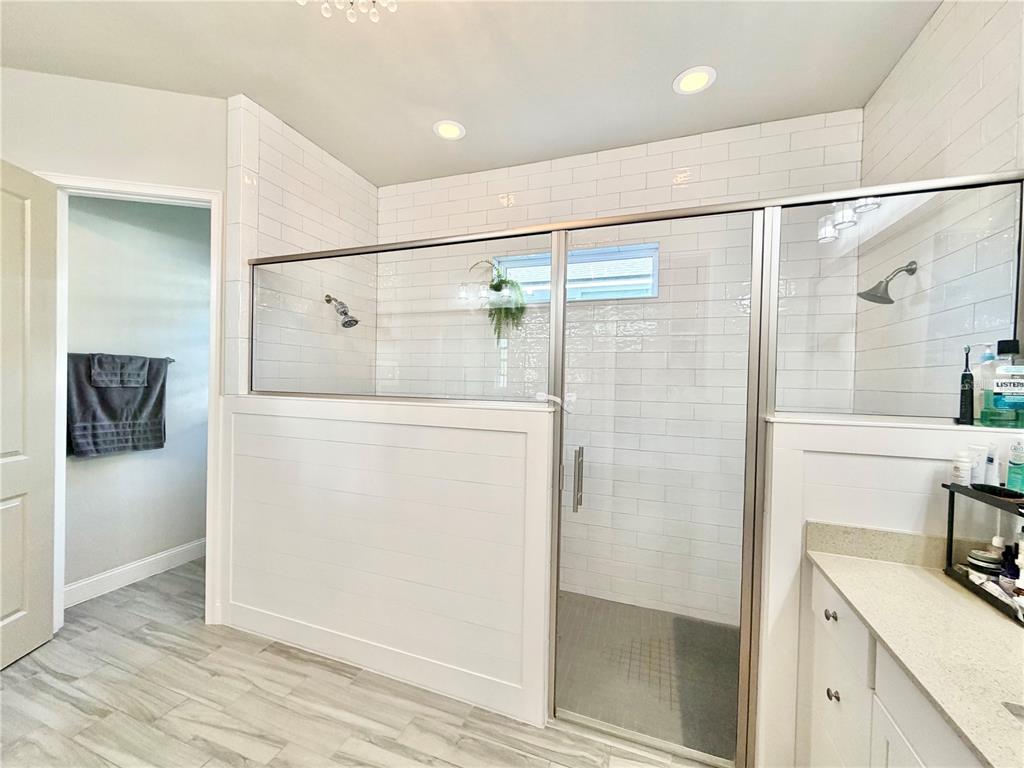 11931 Southwest 32nd Lane Gainesville, FL 32608 - Photo 23 of 78 a bathroom with a shower and a sink
