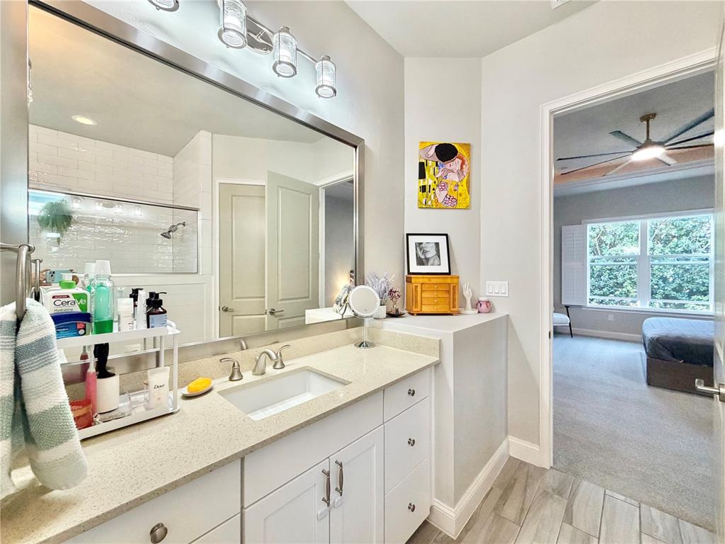 11931 Southwest 32nd Lane Gainesville, FL 32608 - Photo 26 of 78 a bathroom with a sink double vanity and window