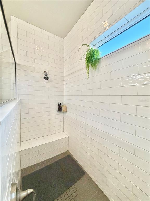 11931 Southwest 32nd Lane Gainesville, FL 32608 - Photo 27 of 78 a bathroom with a bathtub